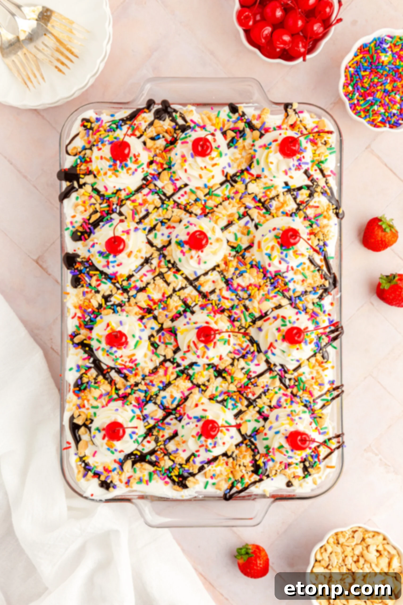 No-Bake Banana Split Bliss 3 Overhead view of No Bake Banana Split Cake in a clear baking dish, ready to be served.