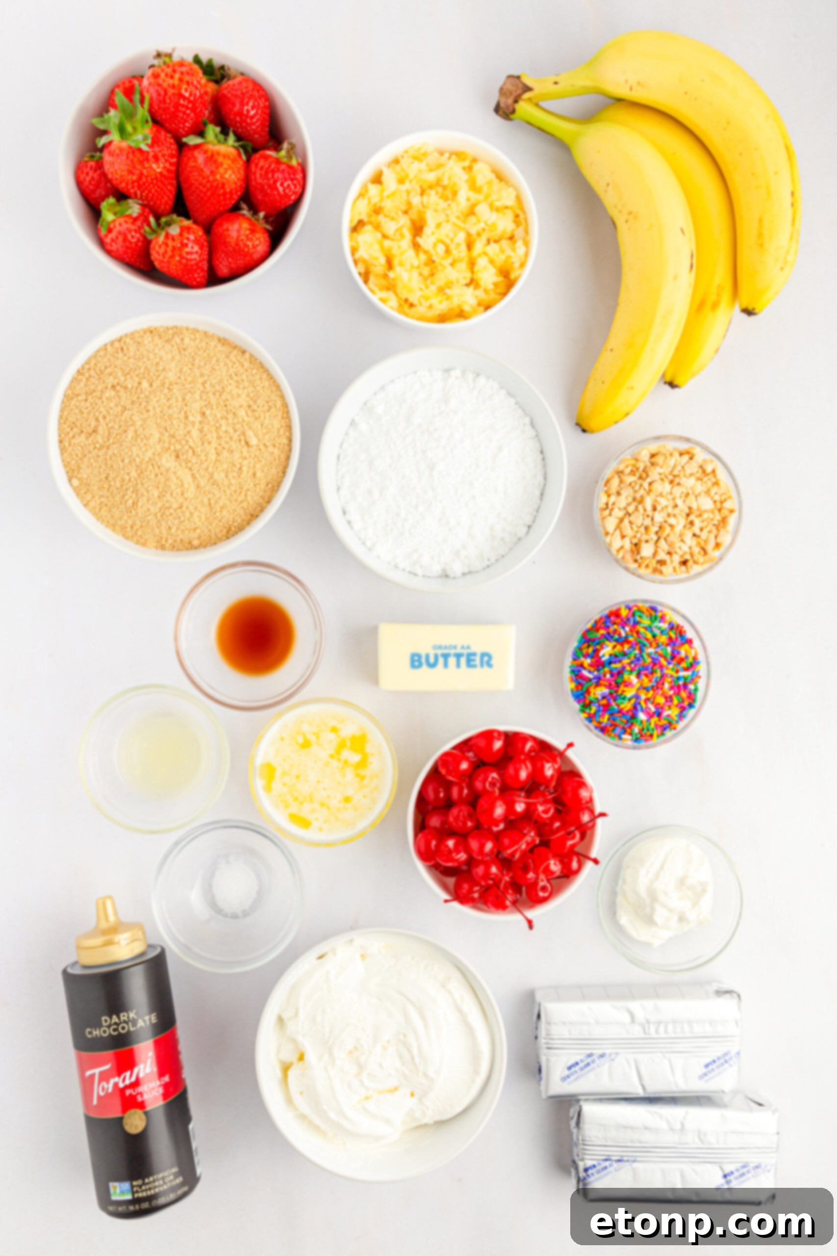 No-Bake Banana Split Bliss 6 Overhead view of all the fresh ingredients neatly laid out for the No Bake Banana Split Cake recipe.