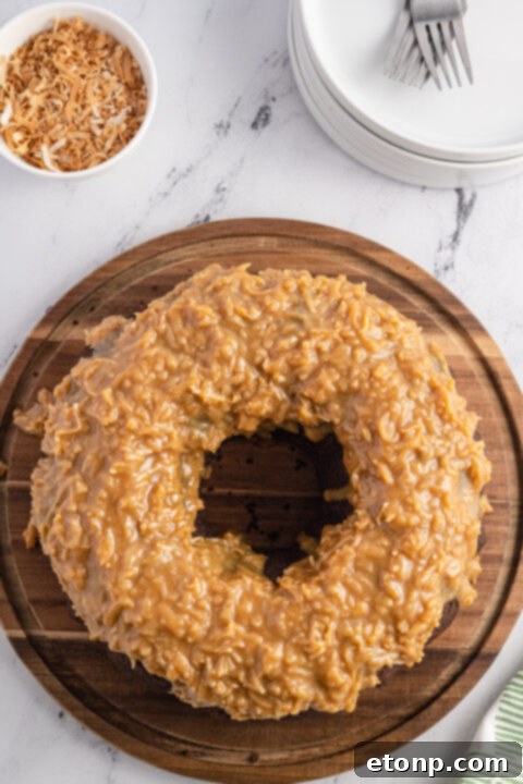 Smooth Samoa cake batter expertly poured into a meticulously prepared bundt pan, ready for baking to perfection.