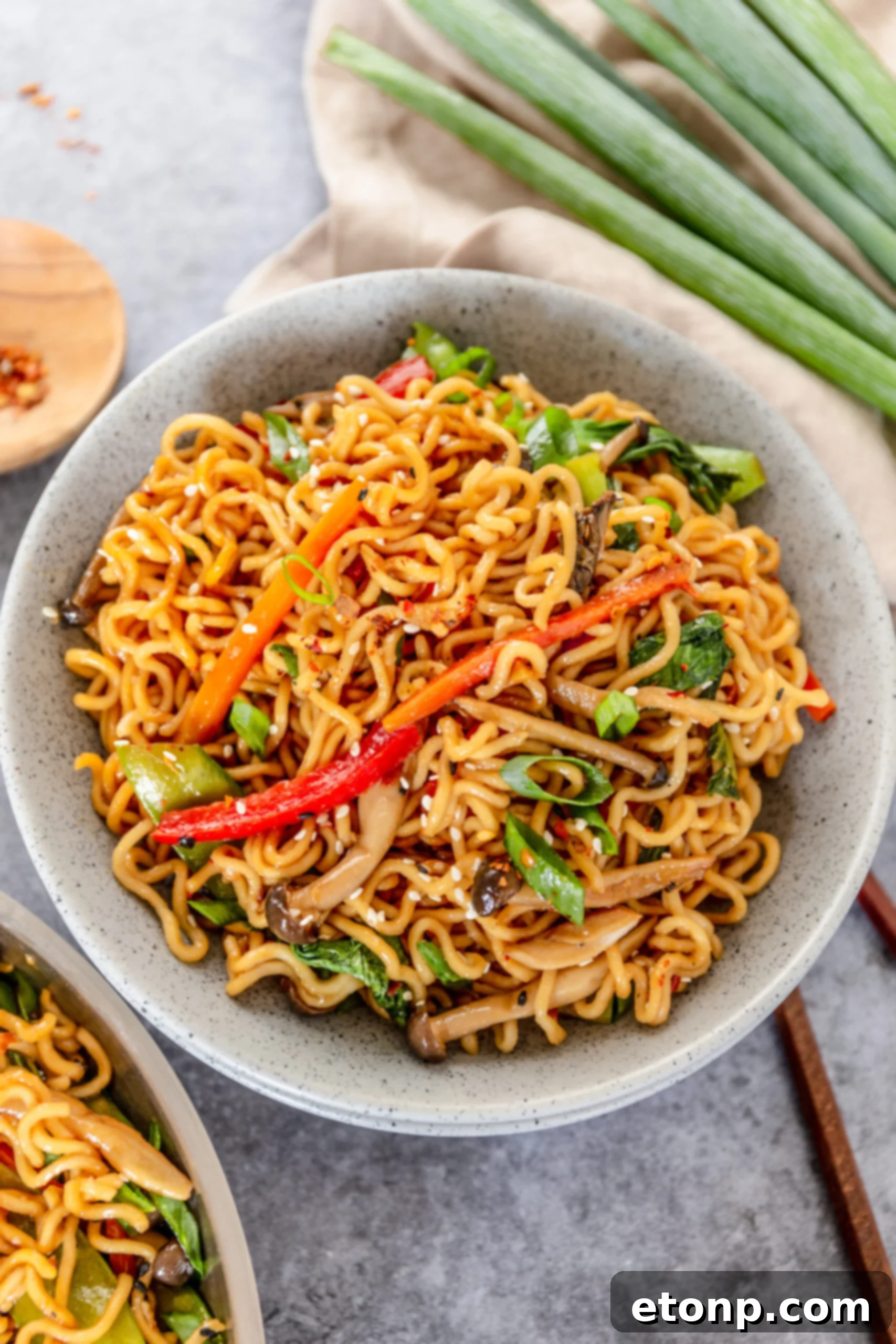 A beautifully presented bowl of Ramen Stir Fry with vibrant vegetables and noodles, ready to be enjoyed.