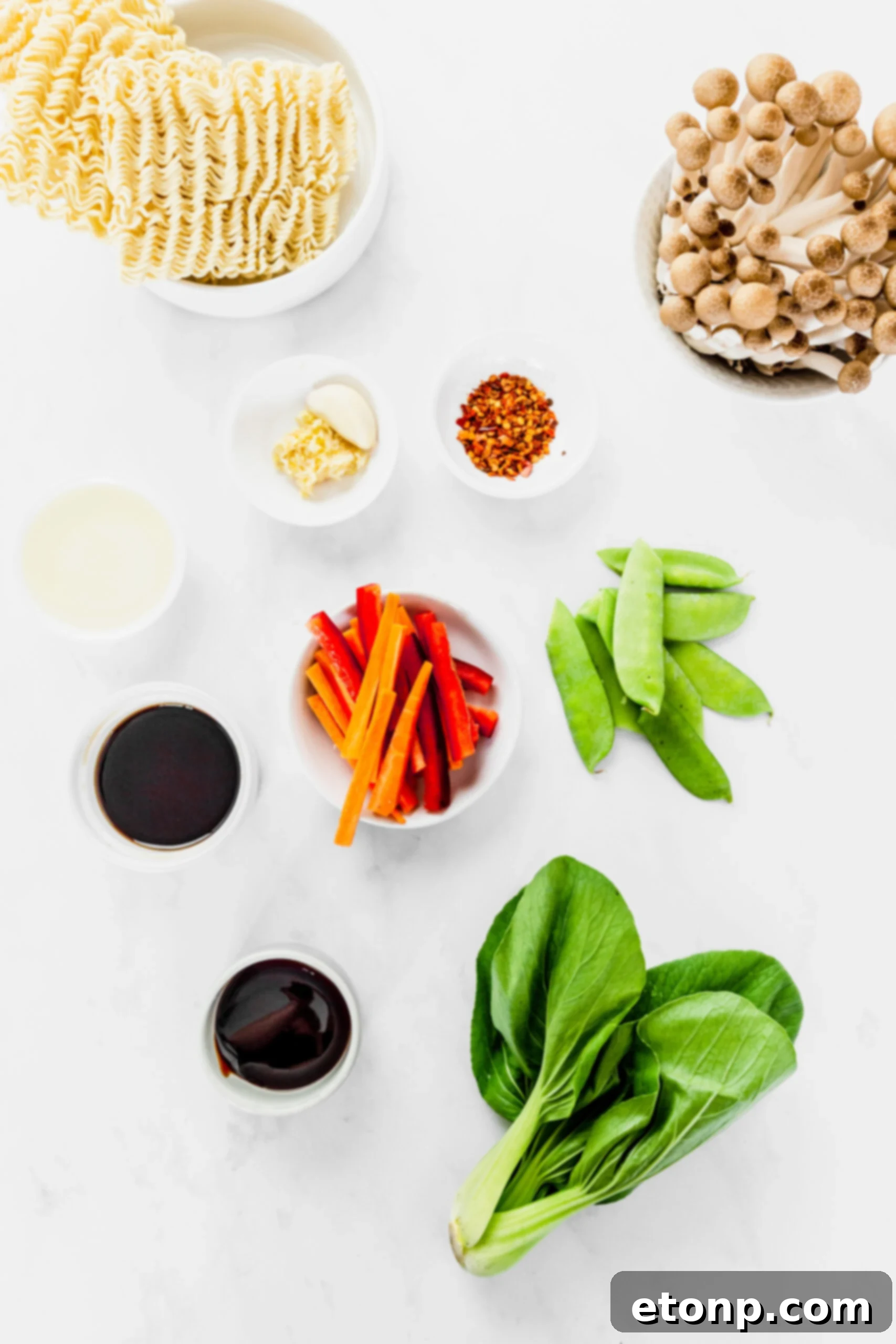 All the fresh ingredients carefully laid out for the Ramen Stir Fry recipe, showcasing vibrant vegetables and ramen noodles.