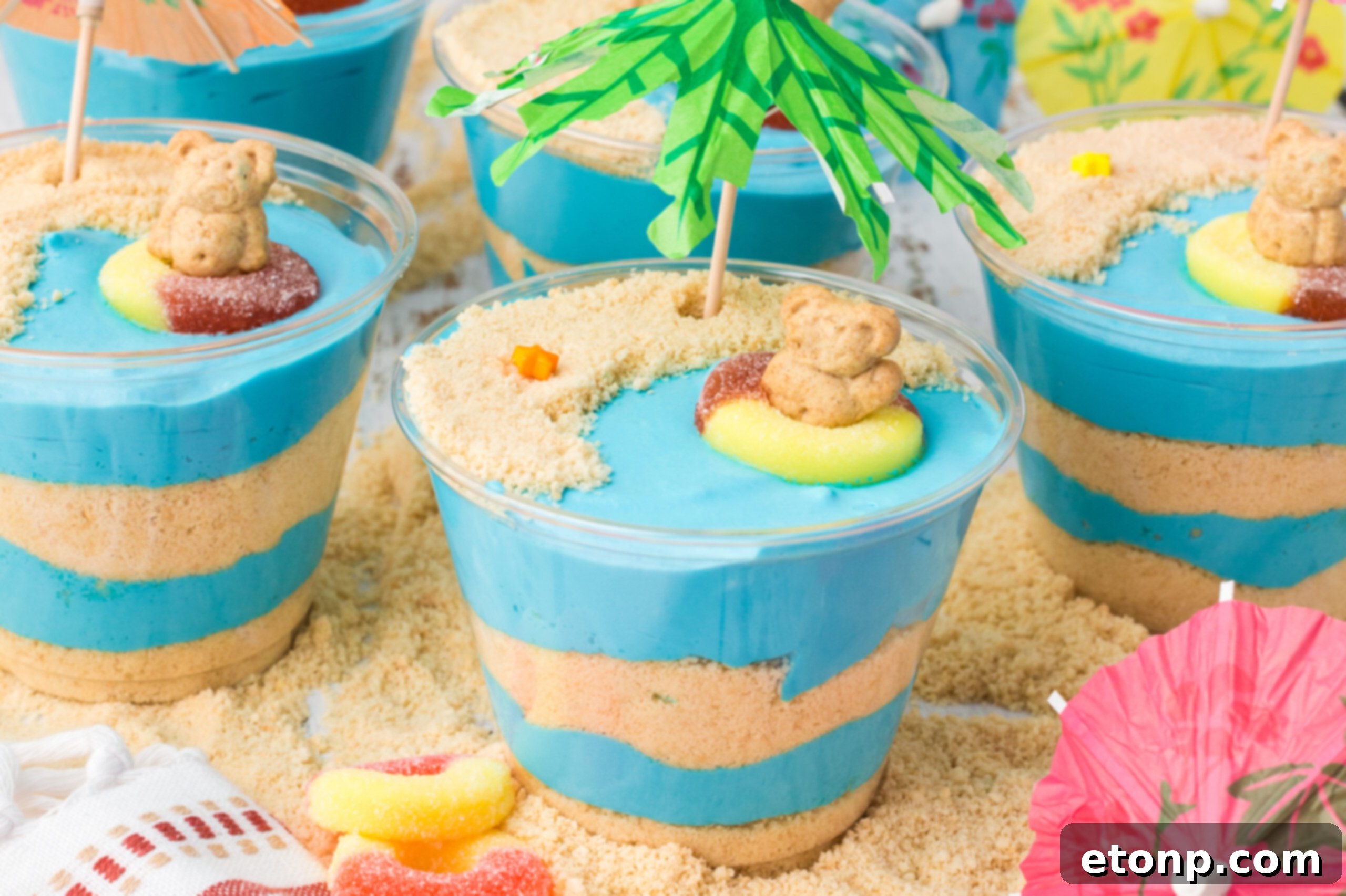 Front view of Beach Cheesecake Pudding Cups, showing the vibrant blue pudding and cookie sand.