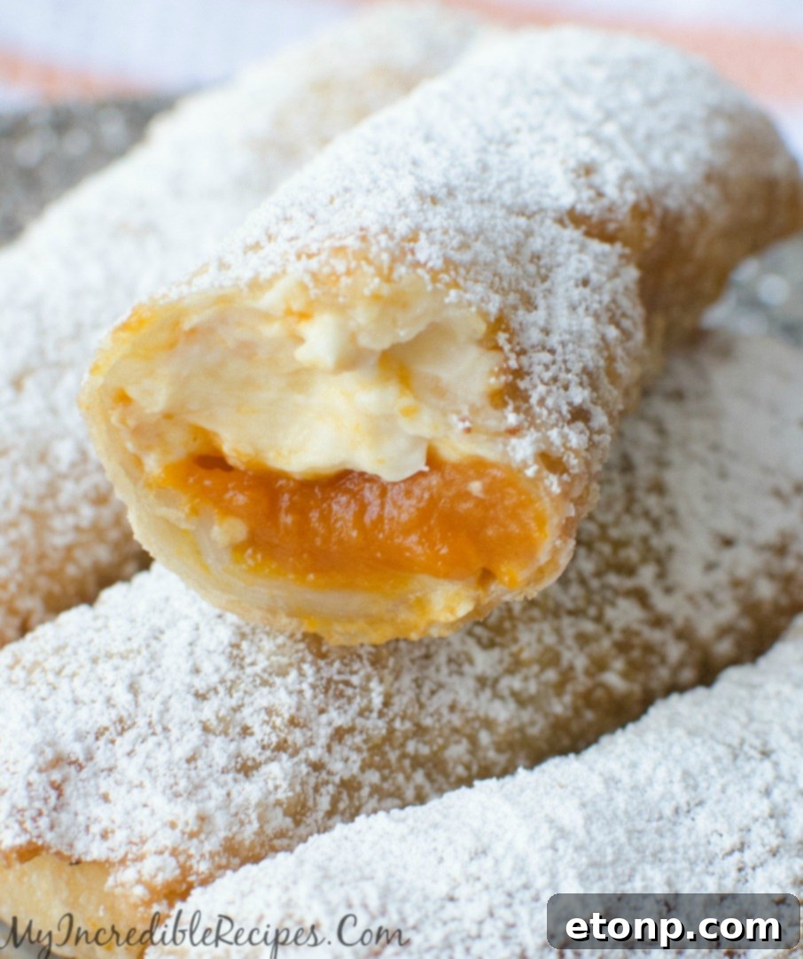 Autumn Pumpkin Cheesecake Rolls 2 Crispy Pumpkin Cheesecake Taquitos with powdered sugar