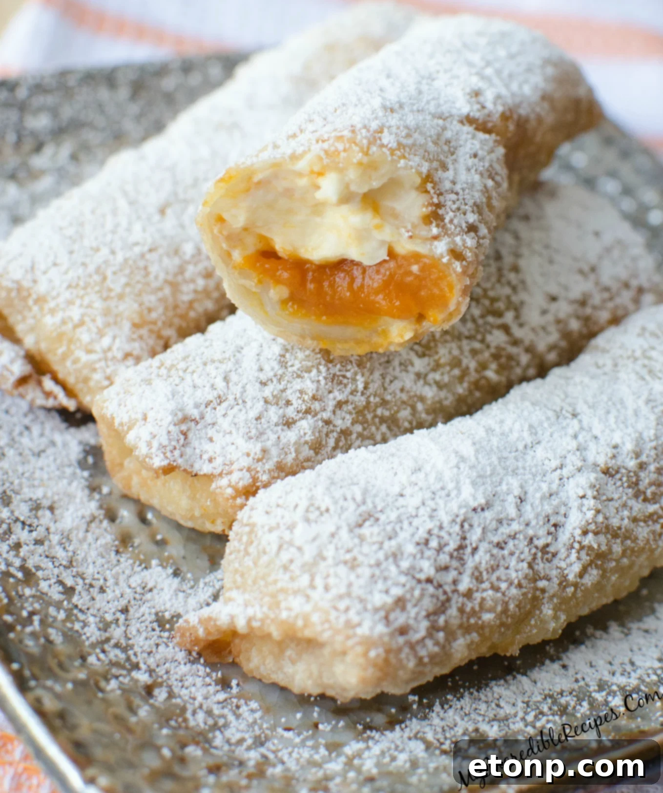 Autumn Pumpkin Cheesecake Rolls 5 Close-up of golden brown pumpkin cheesecake taquitos