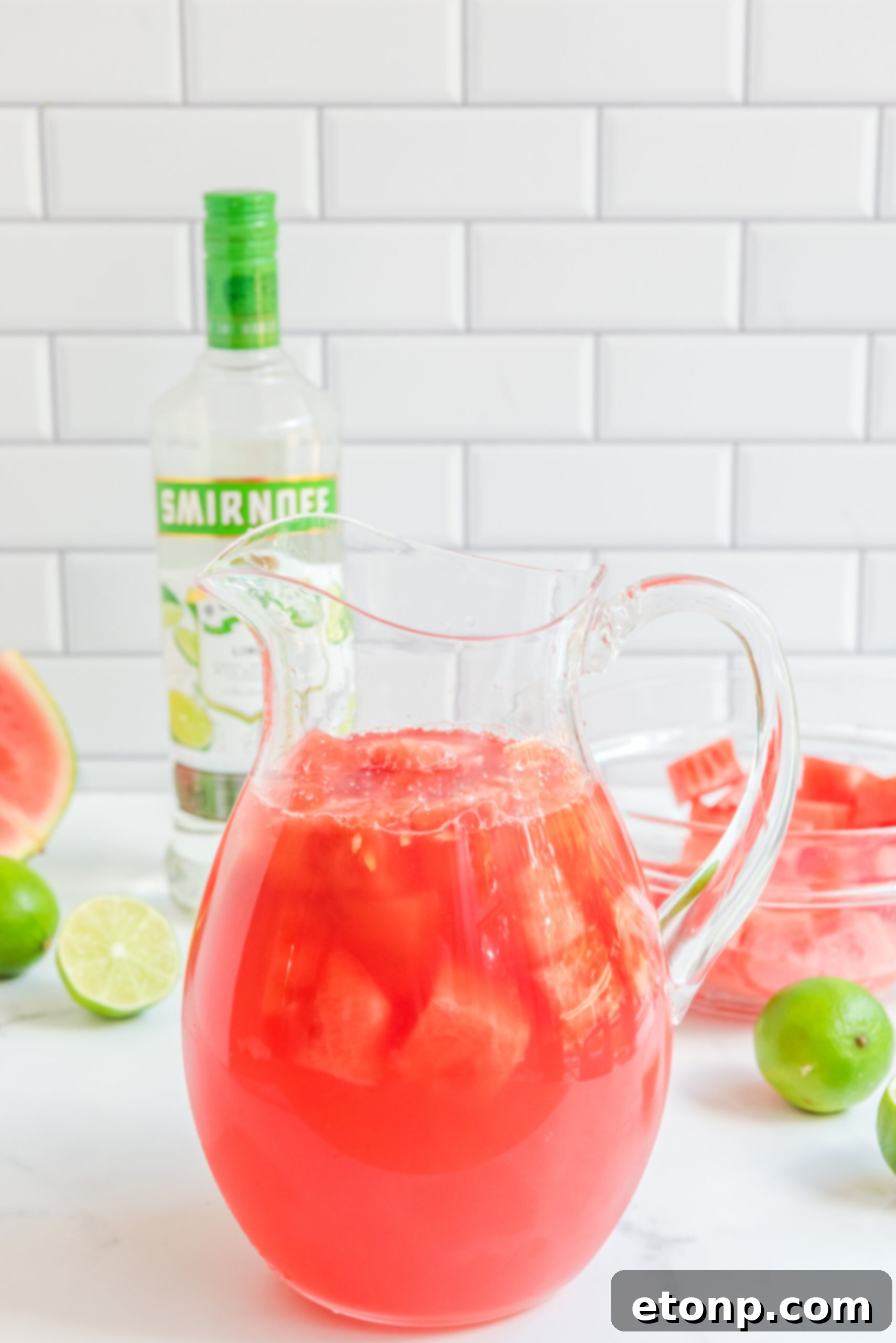 Front view of a glass pitcher full of Watermelon Cocktail.