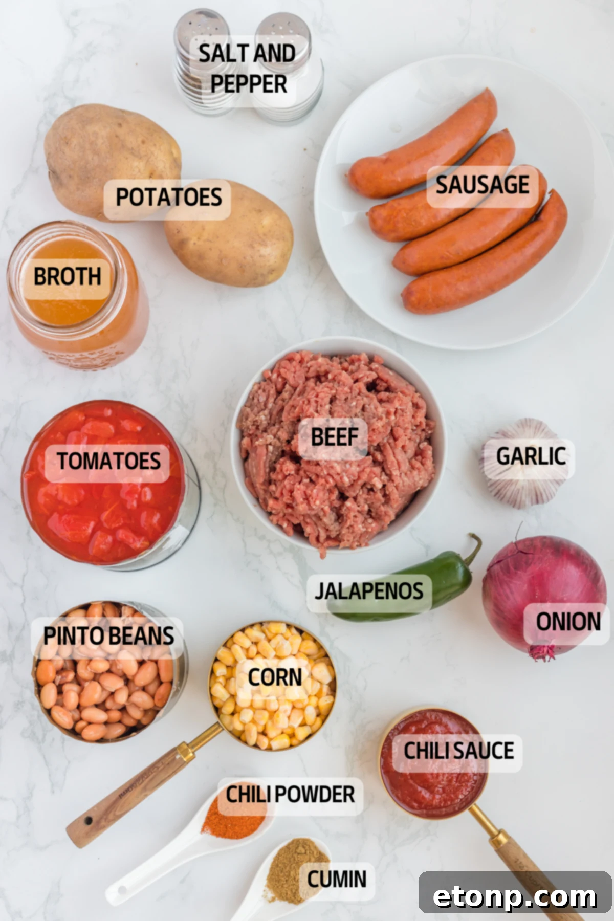 Hearty Lone Star Slow Cooker Stew 7 Overhead view of all the fresh ingredients needed to make Slow Cooker Texas Cowboy Stew, laid out on a rustic surface.