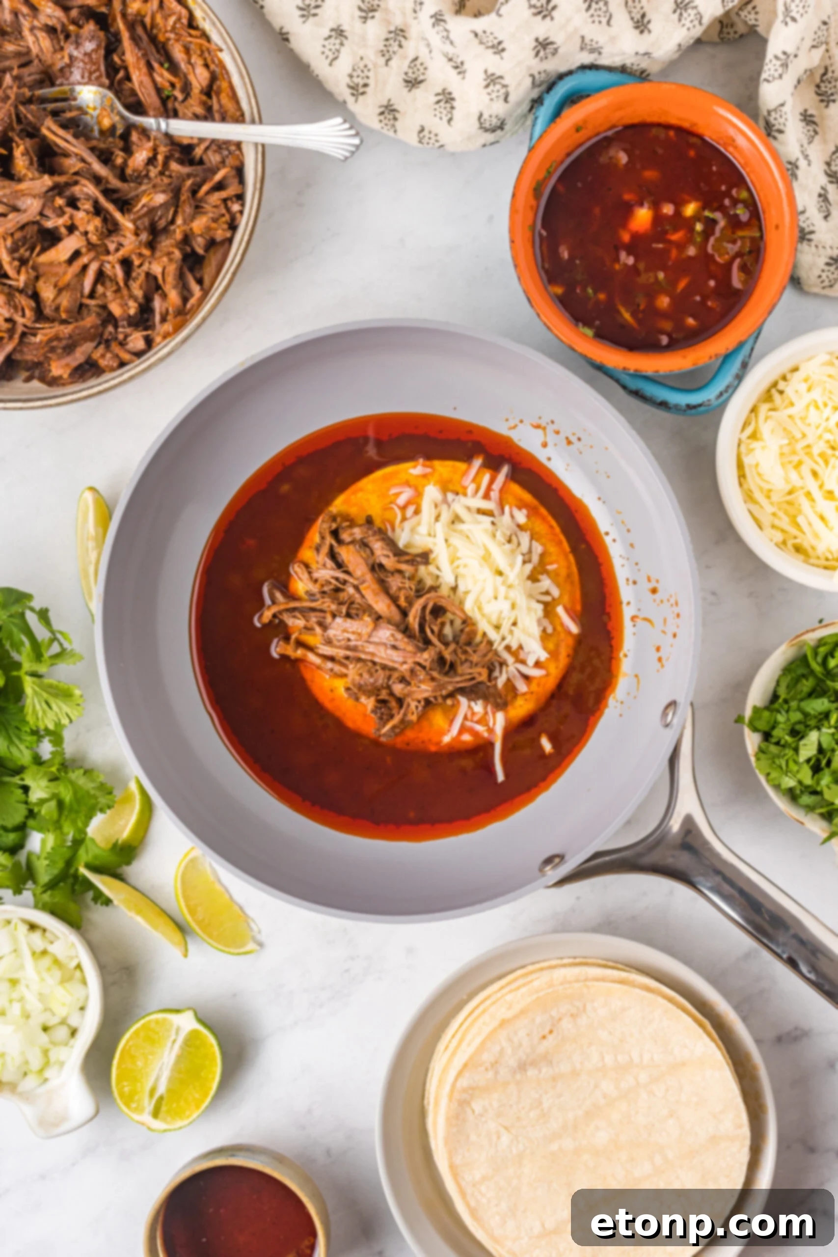 Overhead view of Birria Tacos being made.
