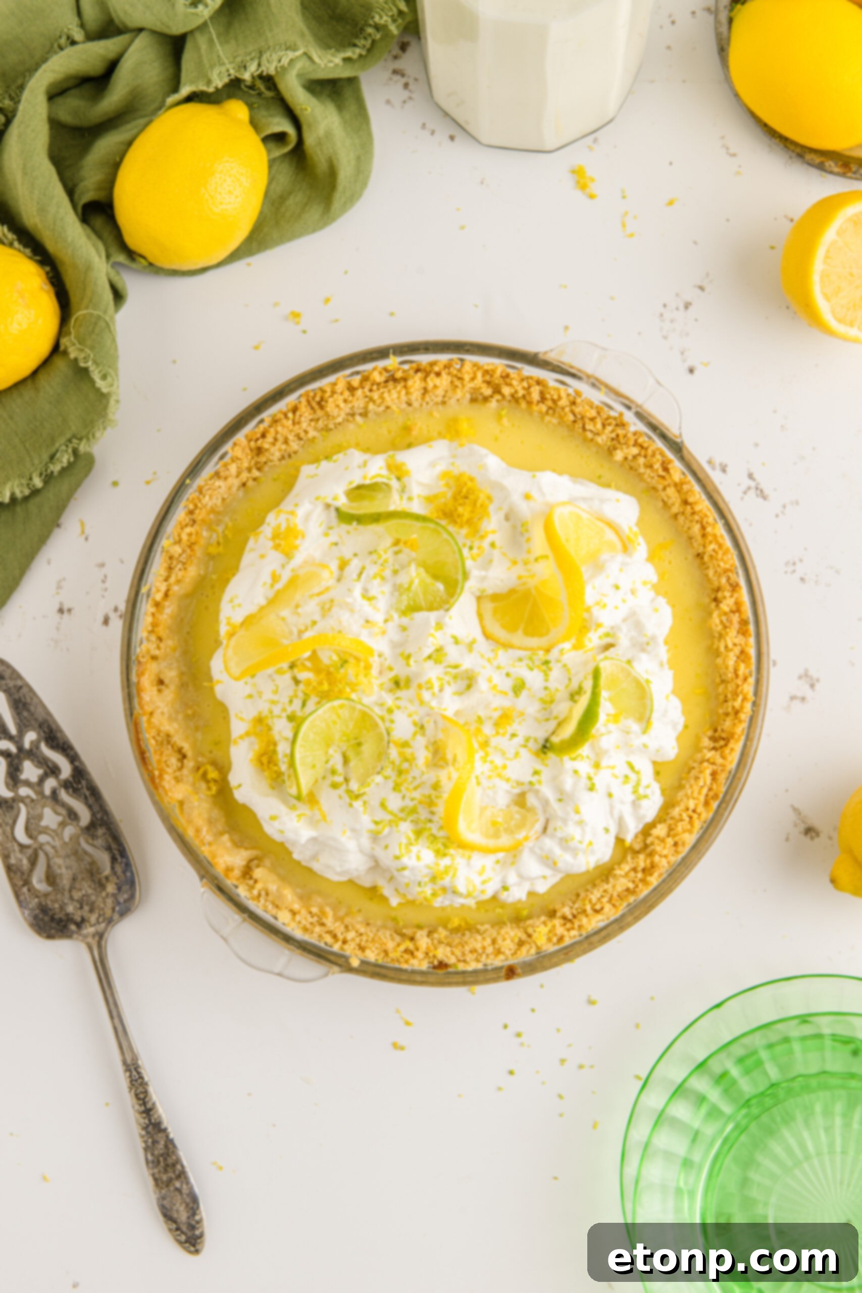 Salty Sweet Coastal Pie 3 Overhead view of Atlantic Beach Pie topped with fresh lemons and limes.