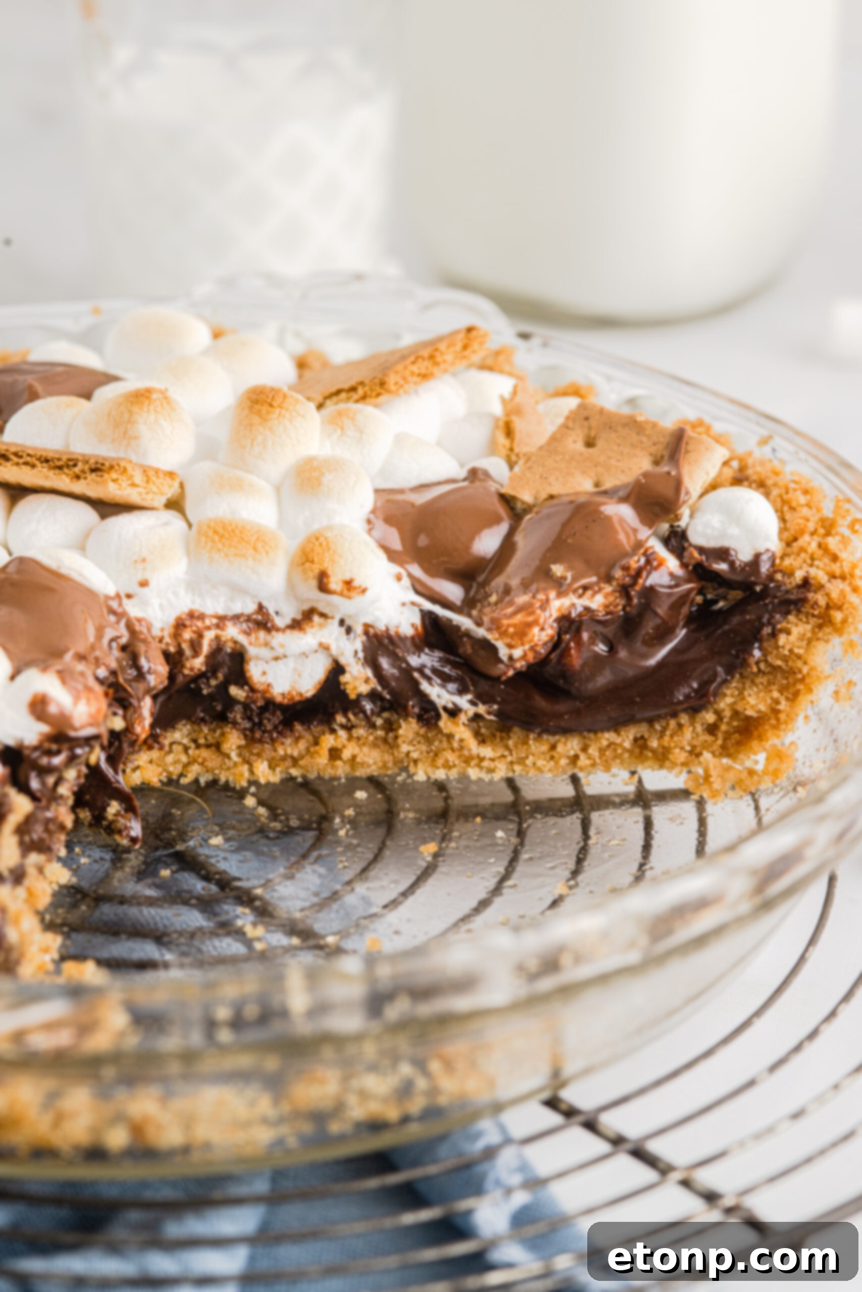 Close up view of a cut piece of S'mores Pie showing the different layers. 