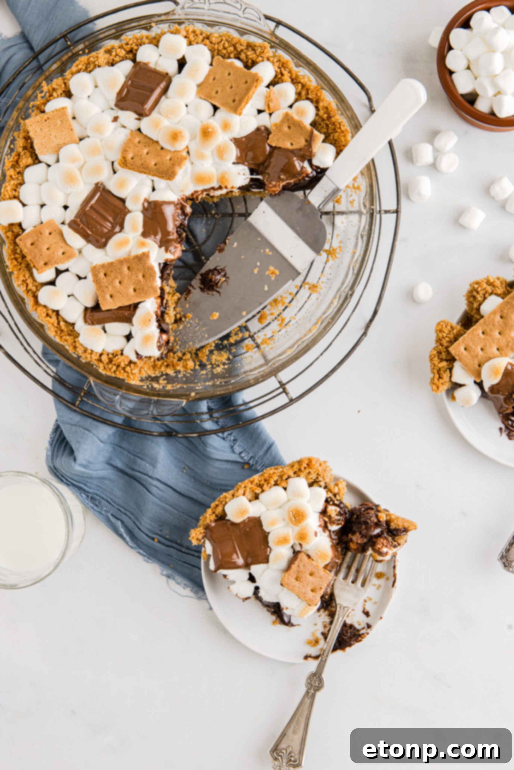 Overhead view of the S'mores Pie being served on two white plates.