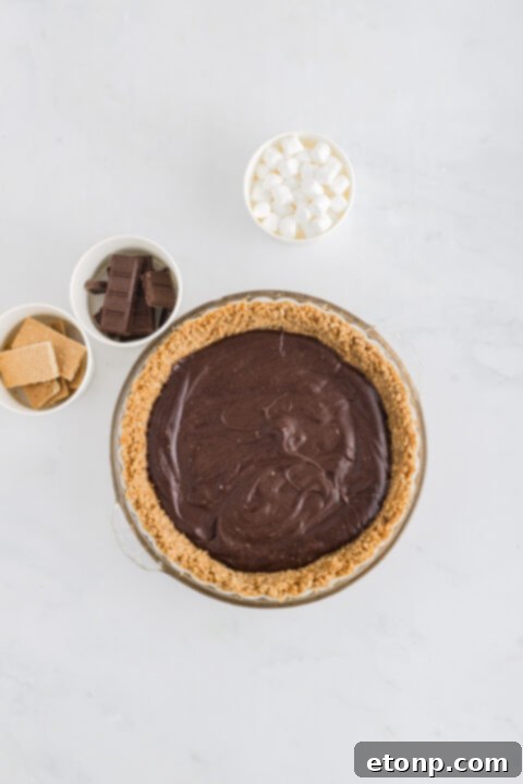 A bottle of vanilla extract, essential for S'mores pie flavor