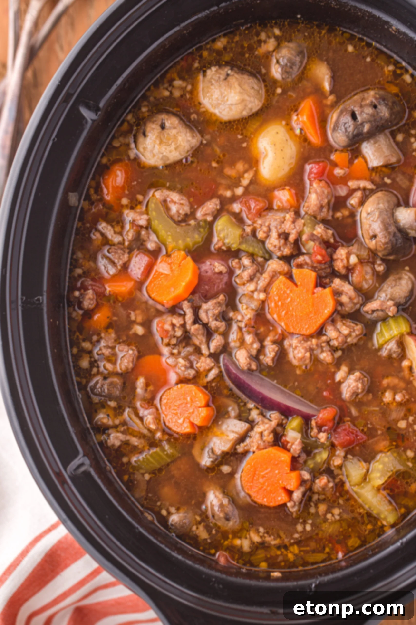Overhead view close up of Witches Brew Stew in a slow cooker.