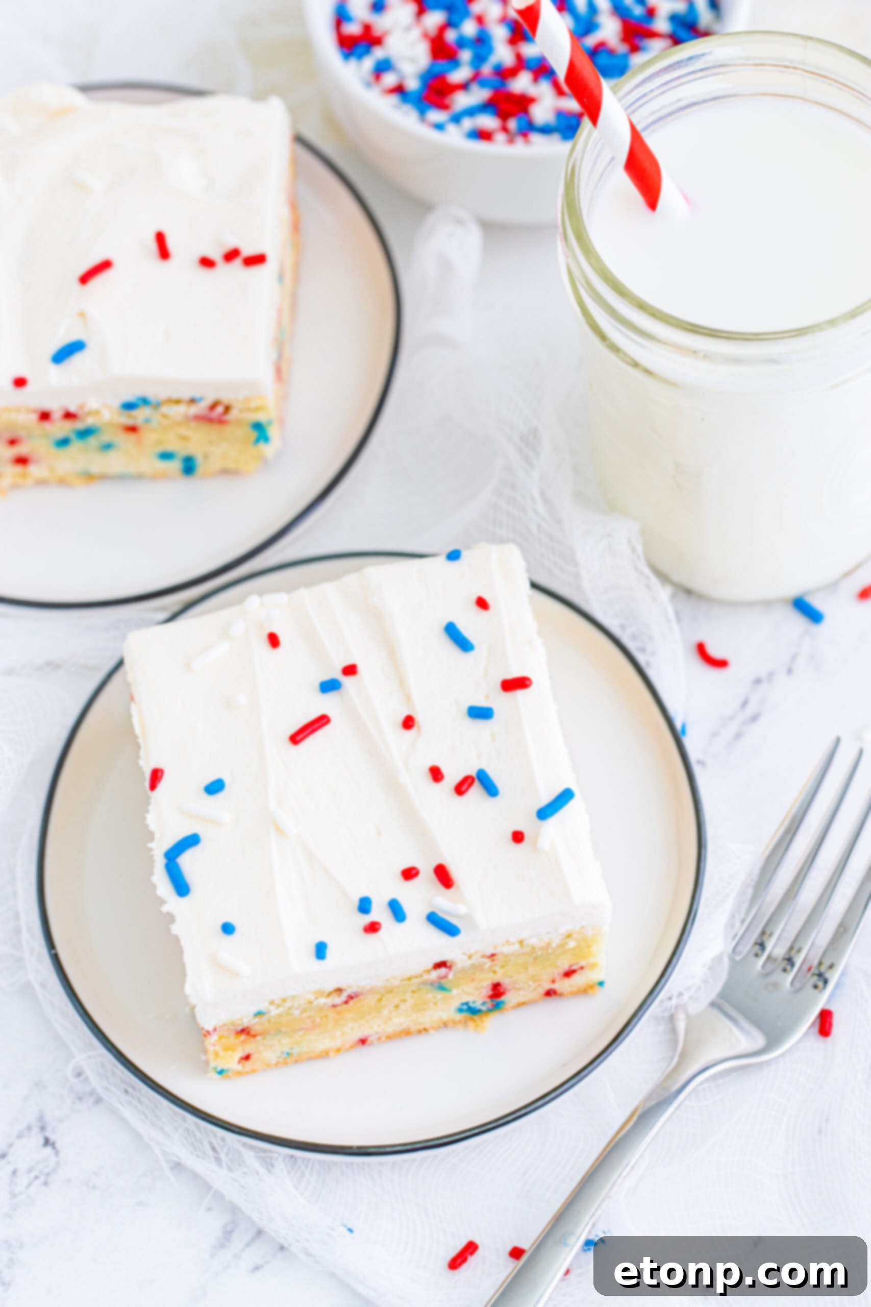 Overhead view of a Patriotic Sugar Cookie Bar on a white plate.