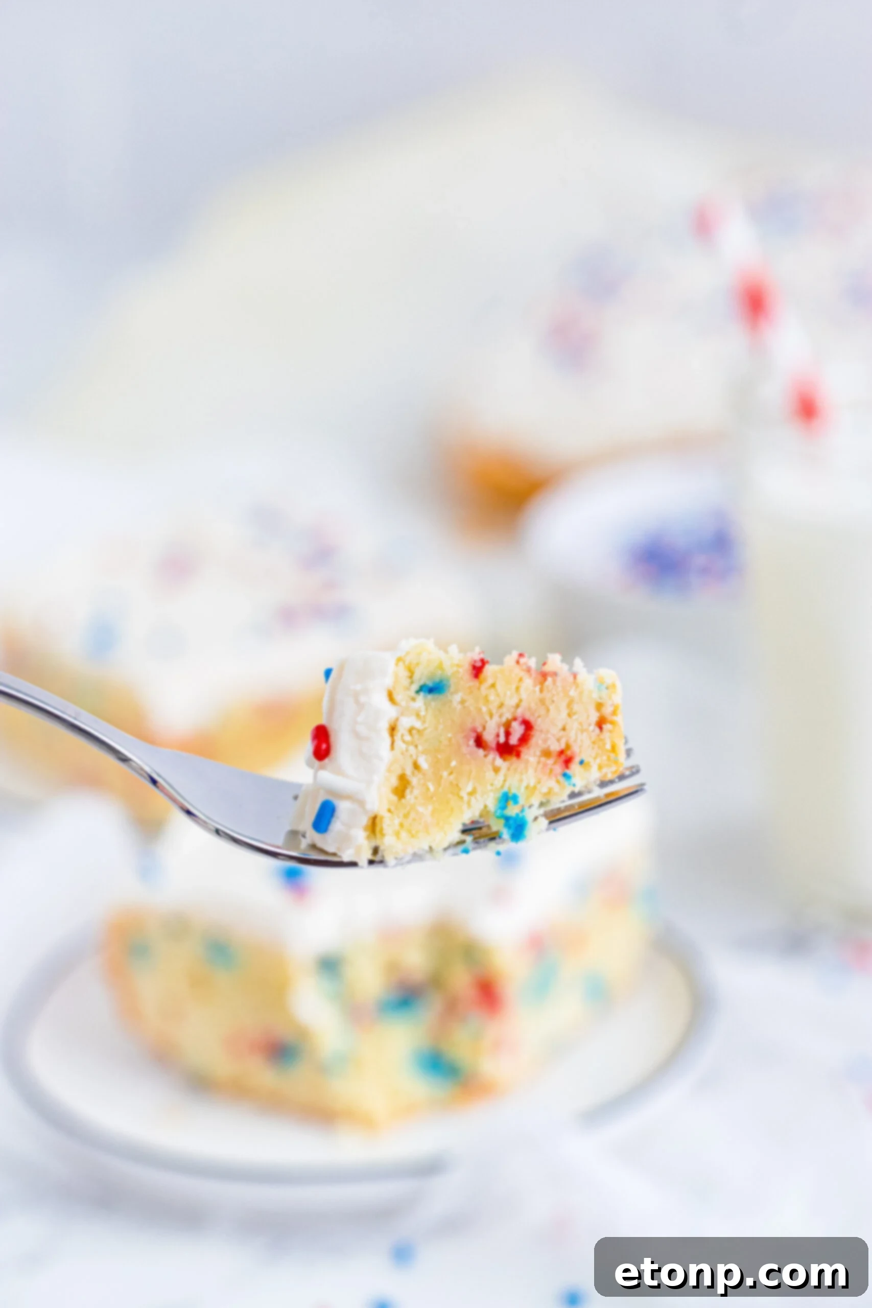 Close up view of a bite of a Patriotic Sugar Cookie Bar.