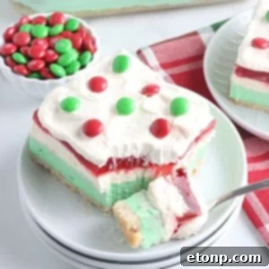 Christmas Lasagna sliced on plate with a bite full on fork