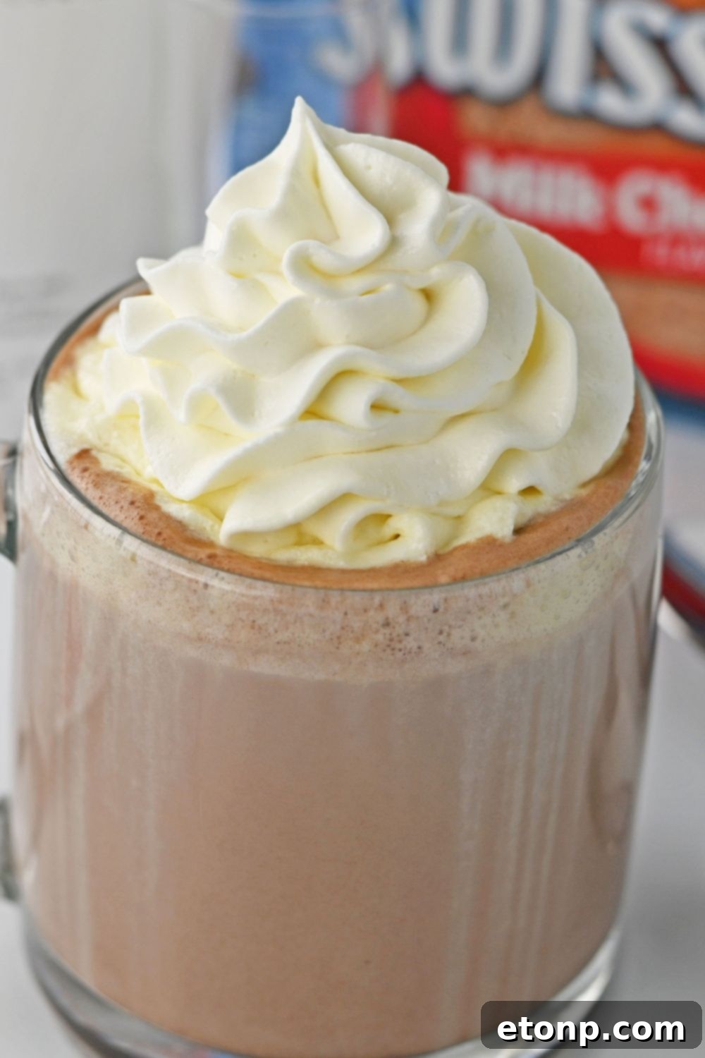 rumchata and hot choclate in glass topped with whipped cream