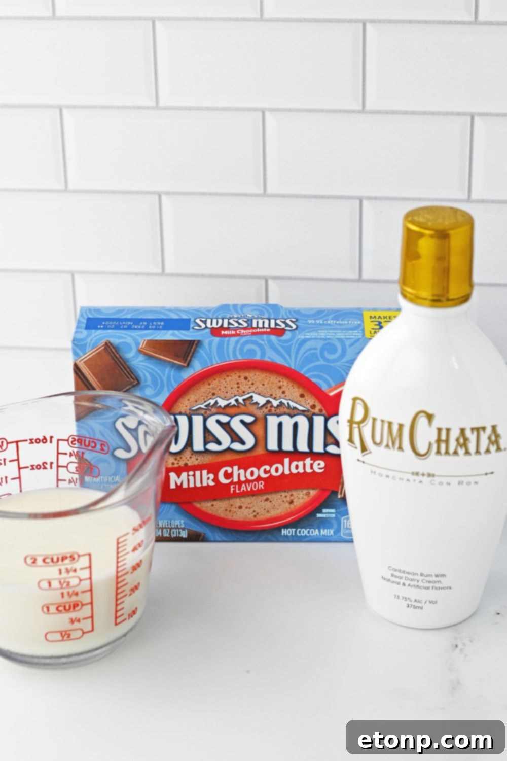 ingredients for rumchata hot chocolate on a white table