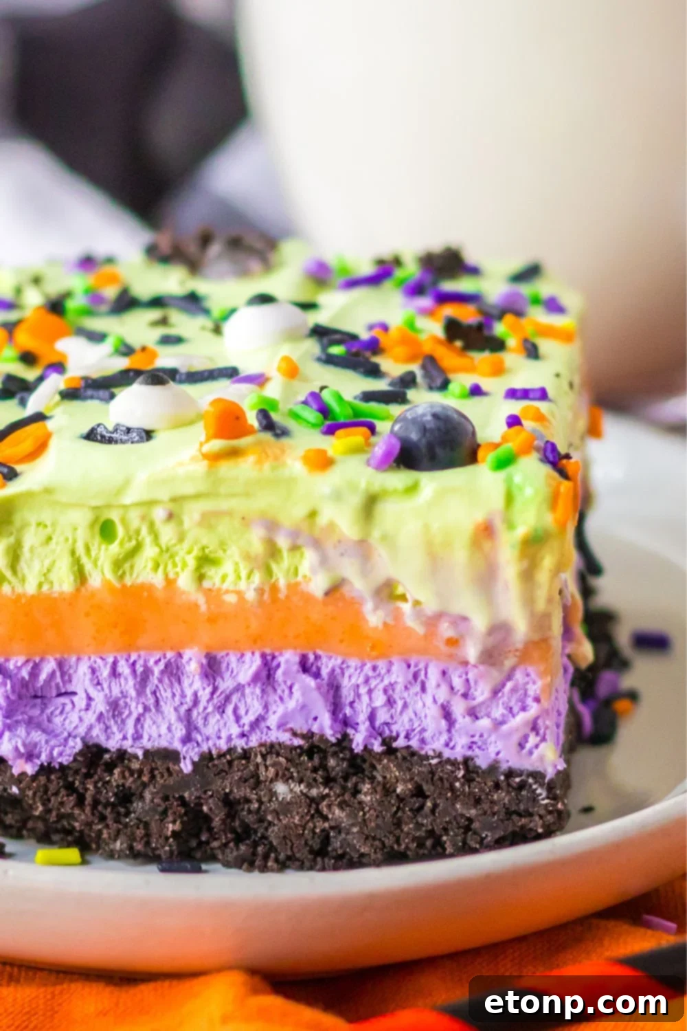 side of dessert on plate to see layers in the Halloween lush dessert