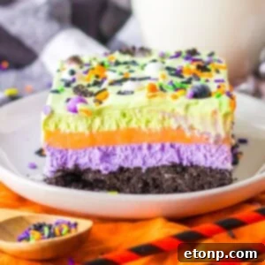 Halloween Lush Dessert sliced and placed on plate with sprinkles in a bowl on side