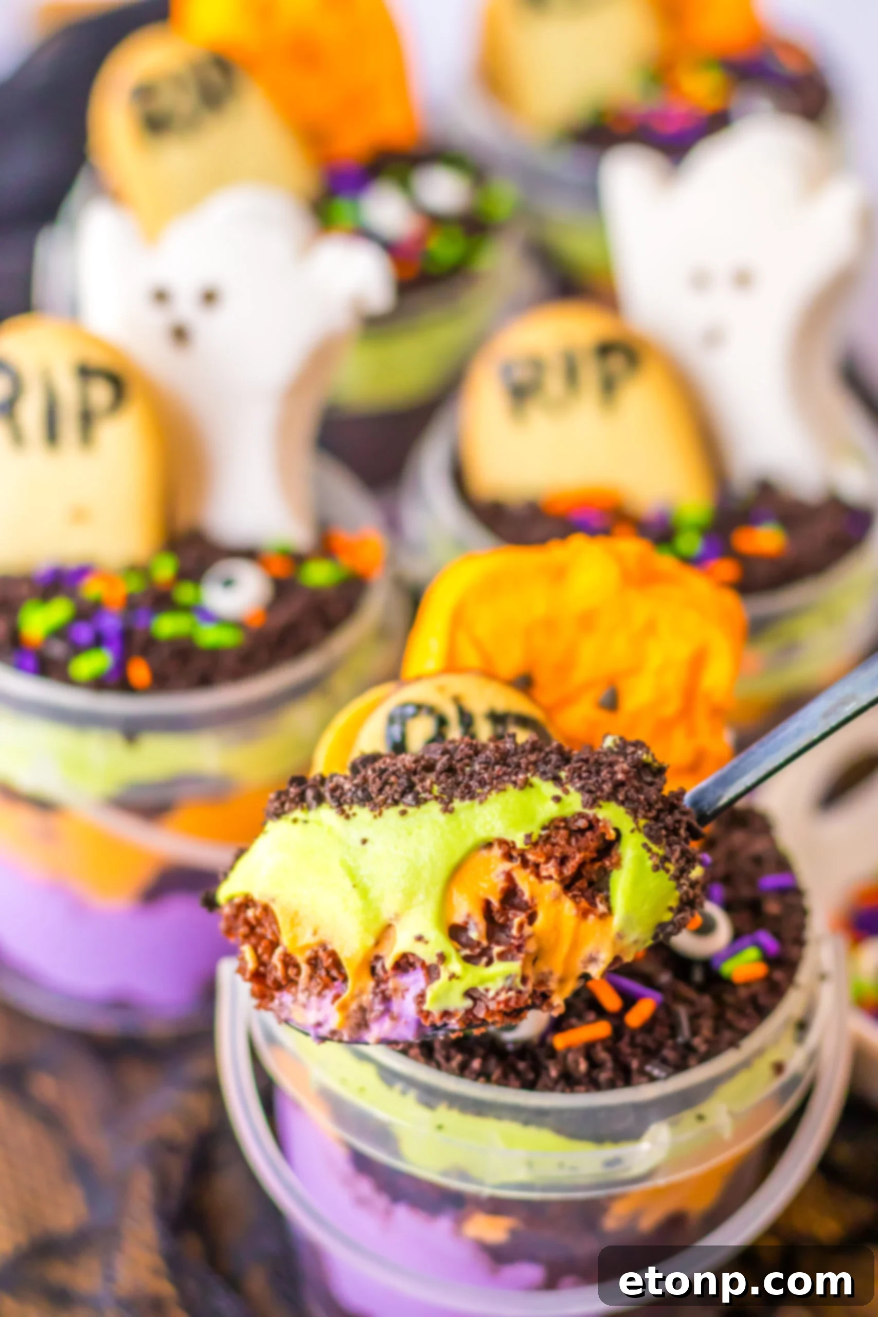 spoon with halloween pudding cup mixture on it 