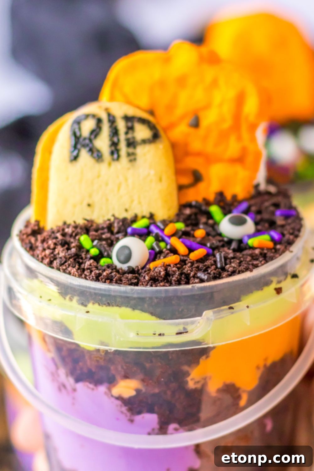 view of halloween pudding cup in hand close up view
