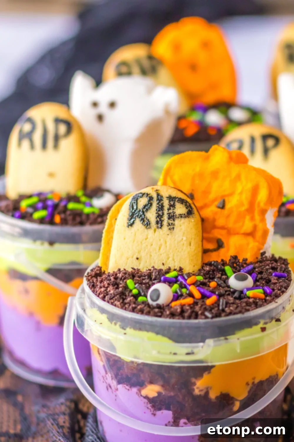 halloween buckets on table with candies decorated