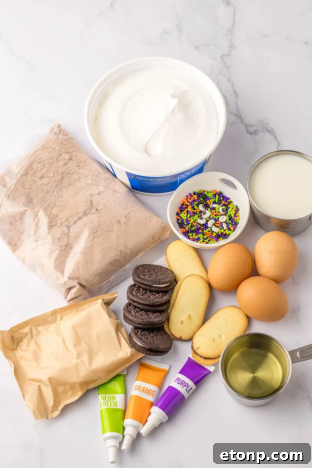 ingredients for halloween pudding cups on table 