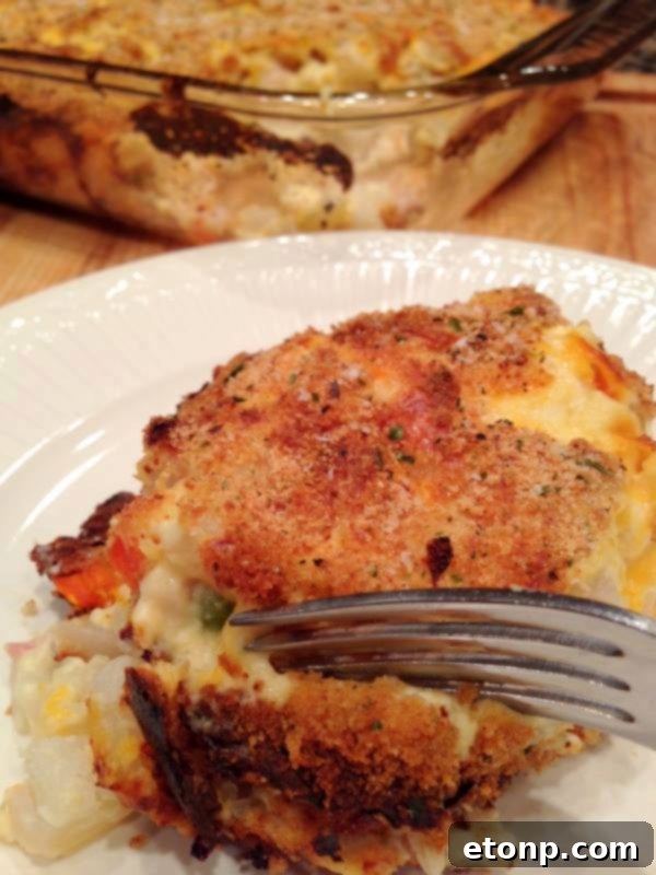 Creamy Hash Brown Chicken Casserole with golden-brown topping, a comforting family dinner idea.