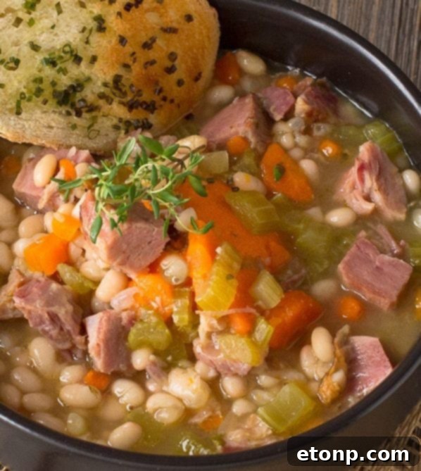 Comforting Ham and Bean Soup with vegetables, perfect for using leftover ham.