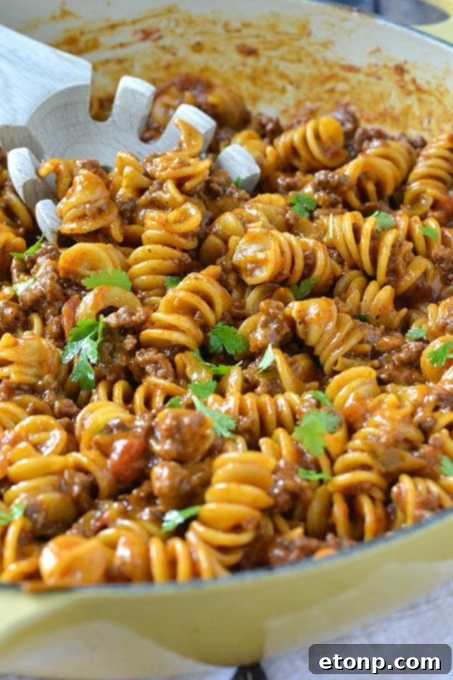 One-Pot Cheesy Taco Pasta, a quick and delicious weeknight meal with ground beef and pasta.