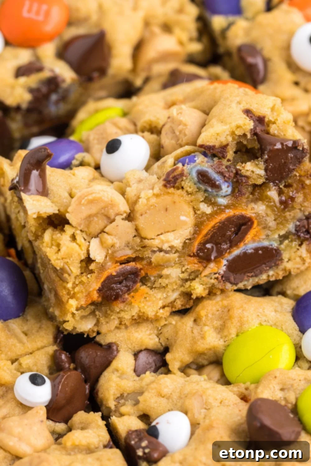 cookie bars stacked on top of each other on pan