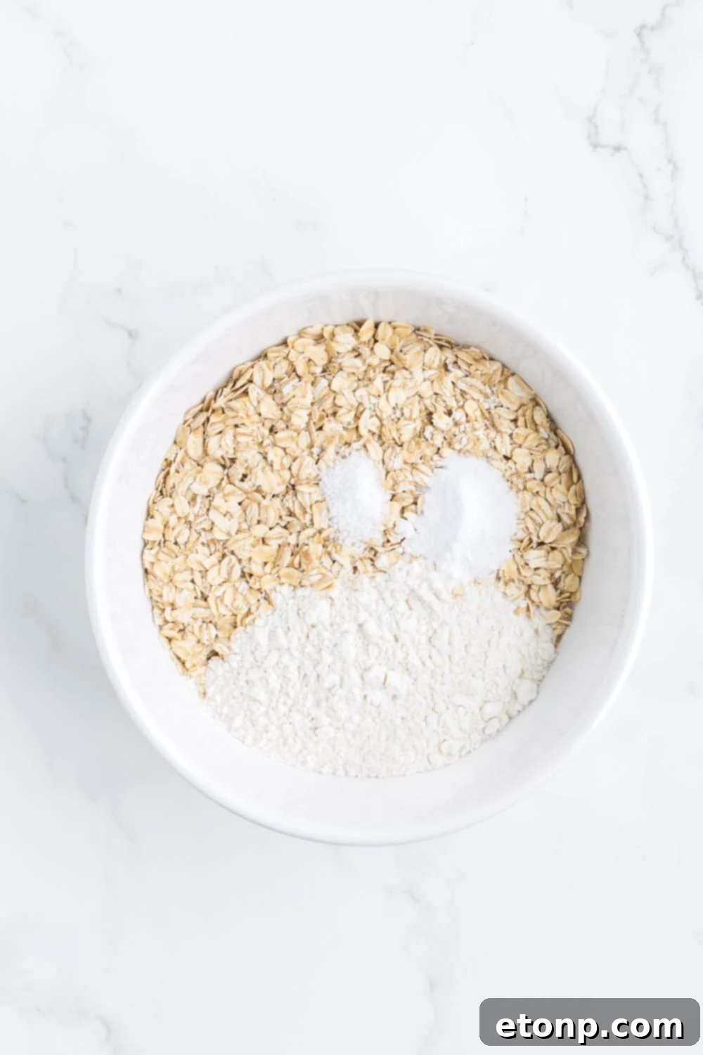 dry ingredients for cookies in a white bowl