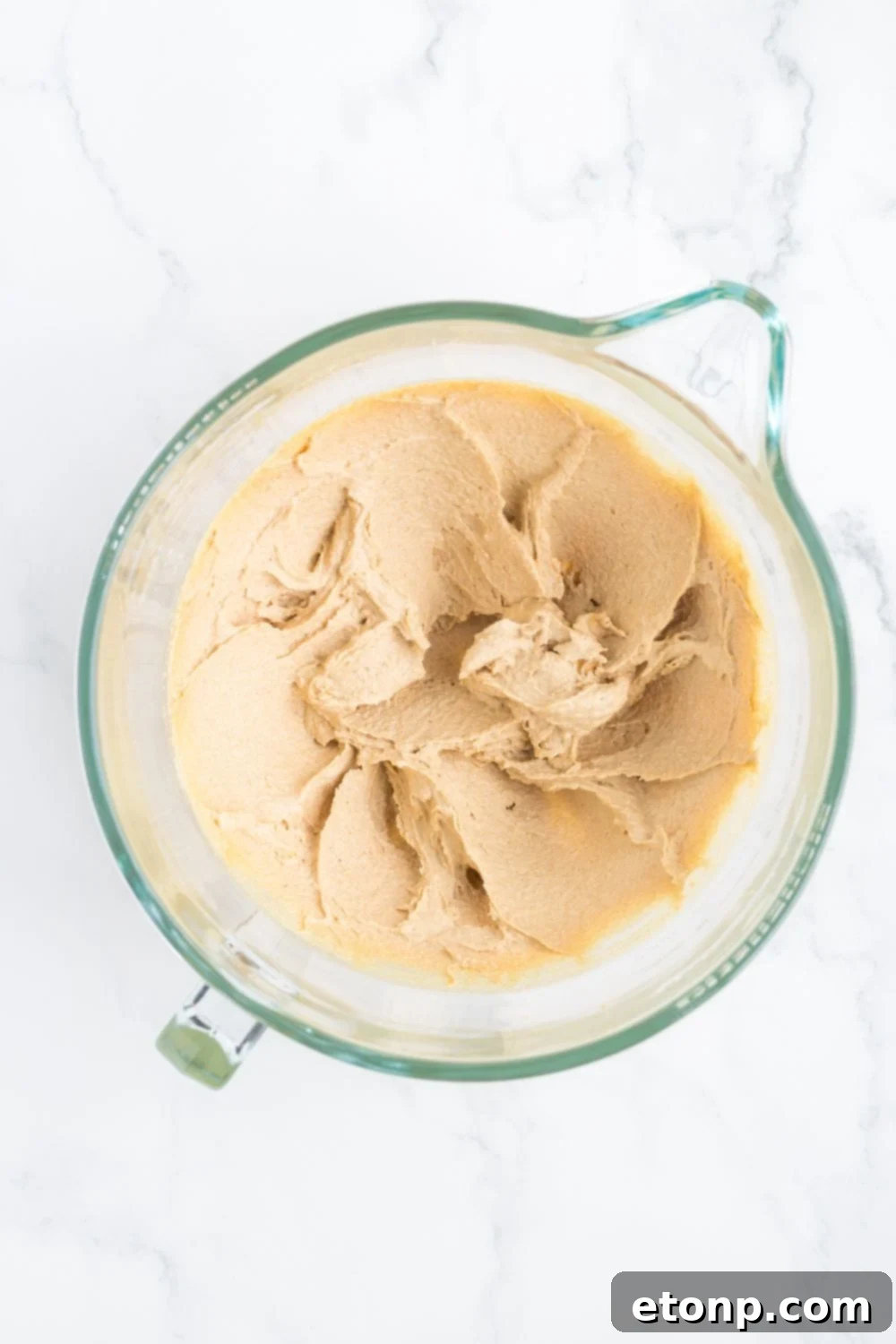 creamed butter and sugar in a measuring cup