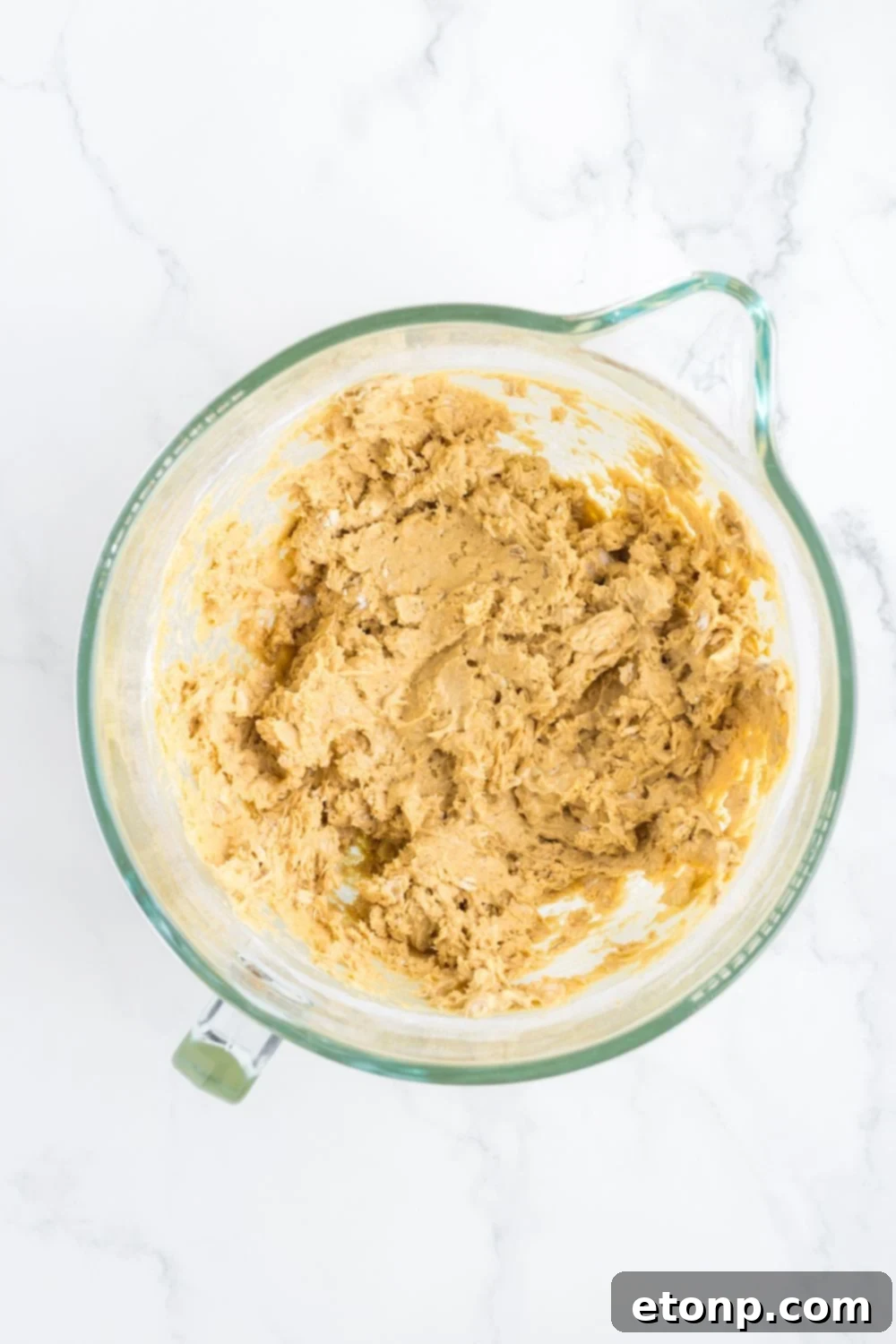 blended cookie batter in a measuring cup