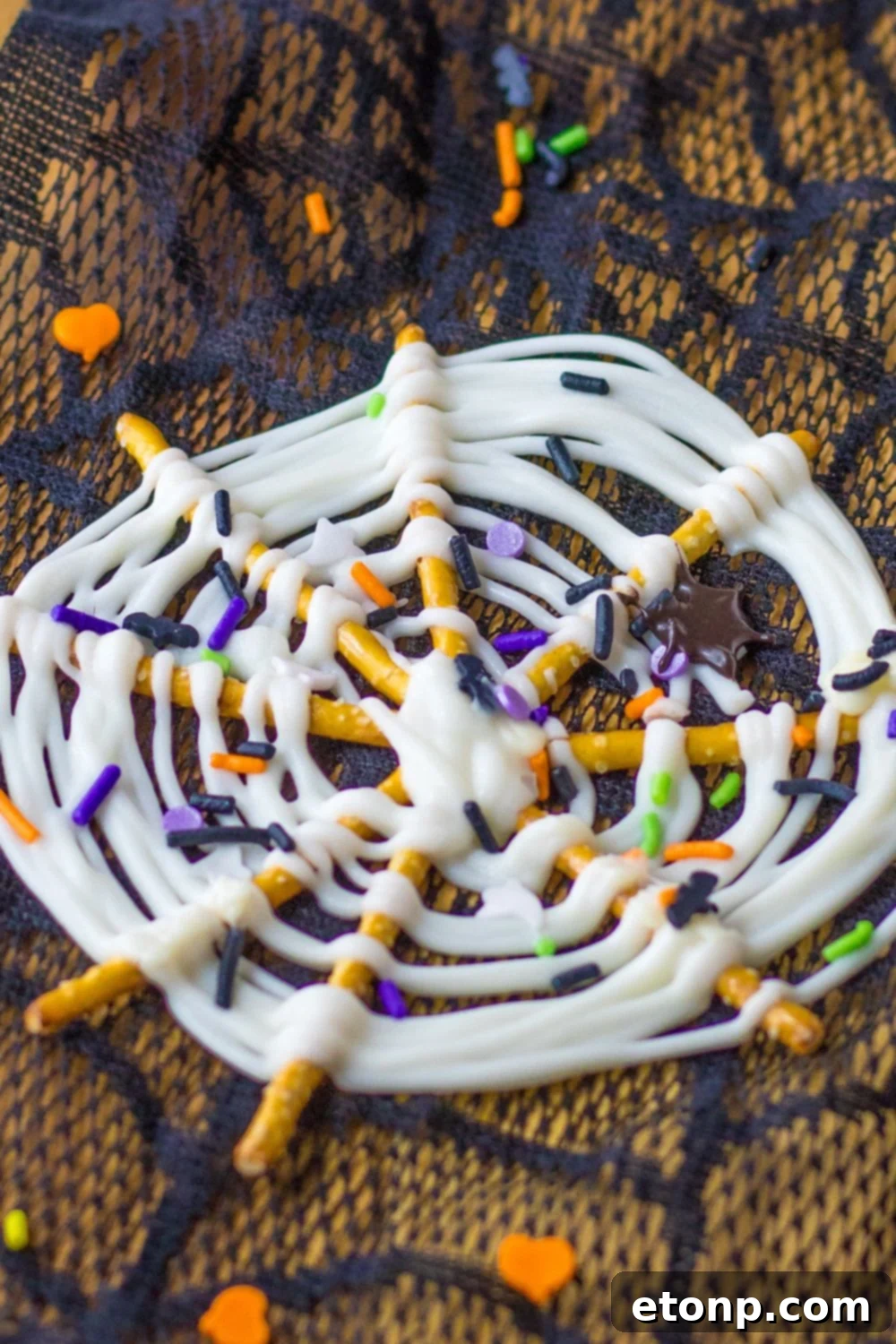 Chocolate Pretzel Spiderwebs arranged on a serving tray