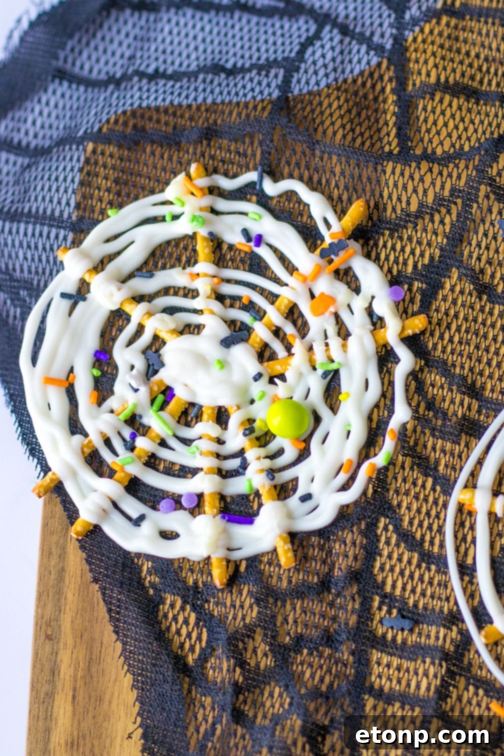 Several web pretzels on a table with a decorative lace background