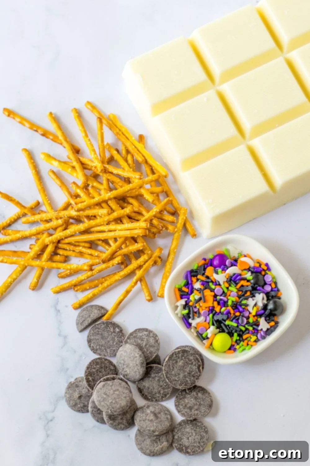 Ingredients laid out on a table for making spider web chocolate snacks