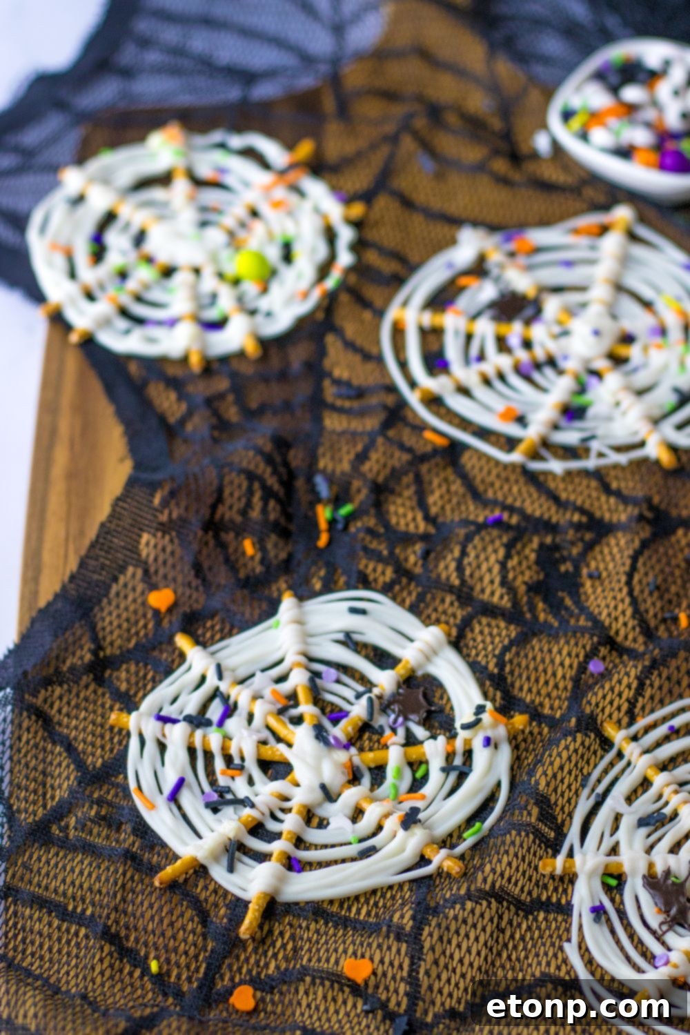 Several Halloween pretzels scattered on a table