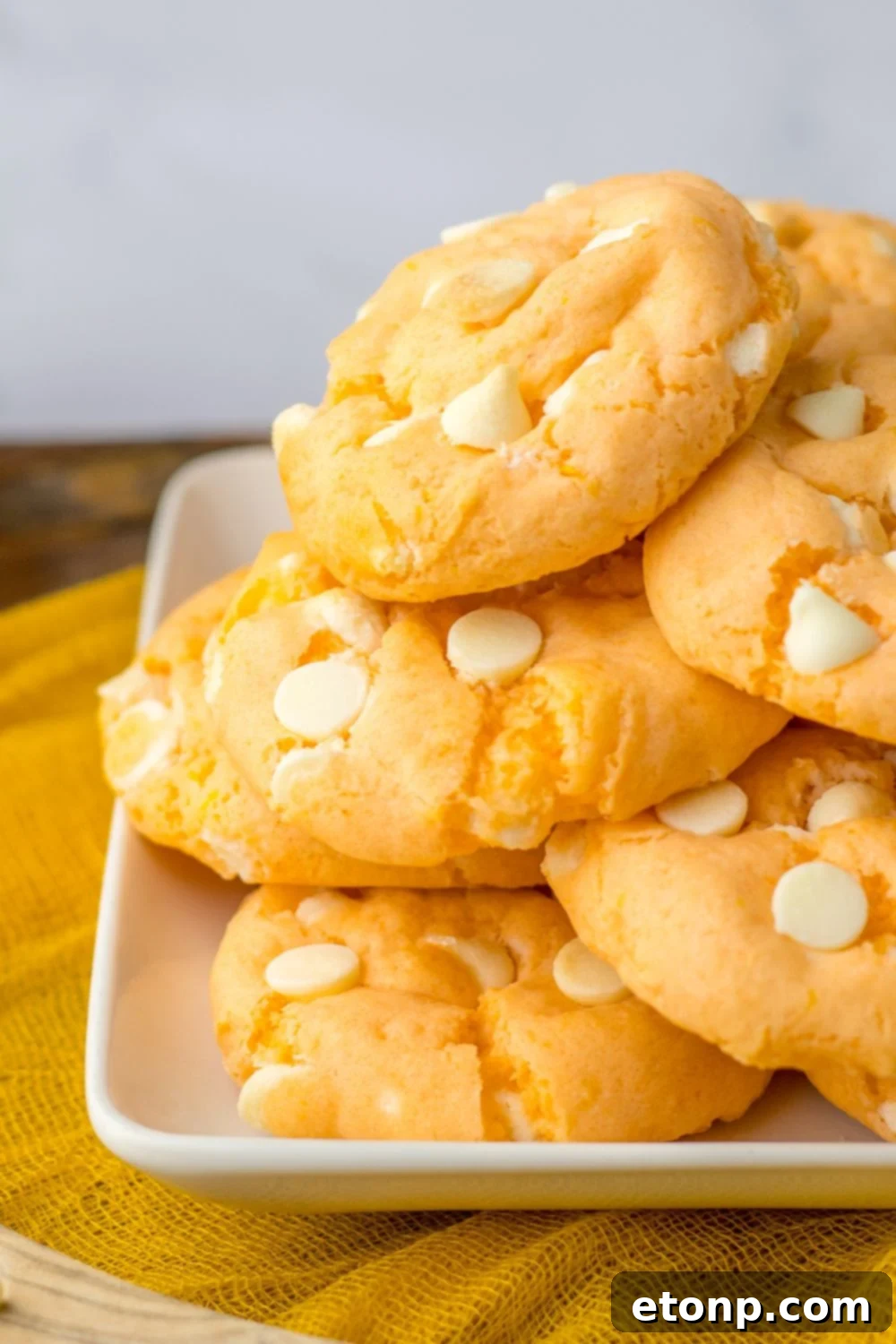 side view of orange cookies on a plate