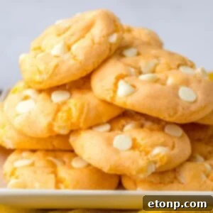Orange Creamsicle Cookies stacked on plate