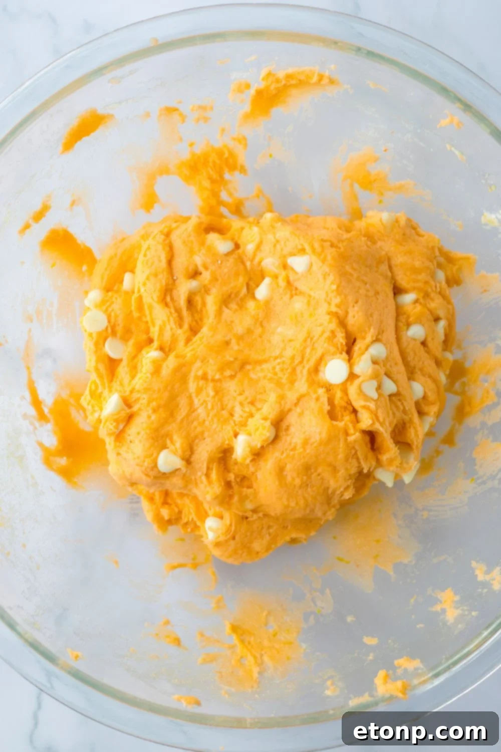 cookie batter creamed together in a glass bowl 