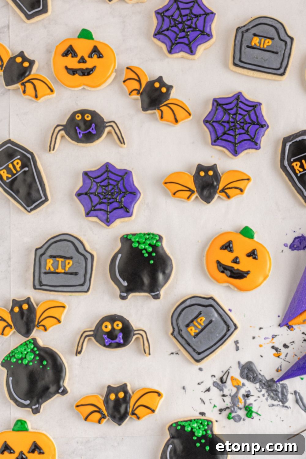 sugar cookies scattered on table for Halloween