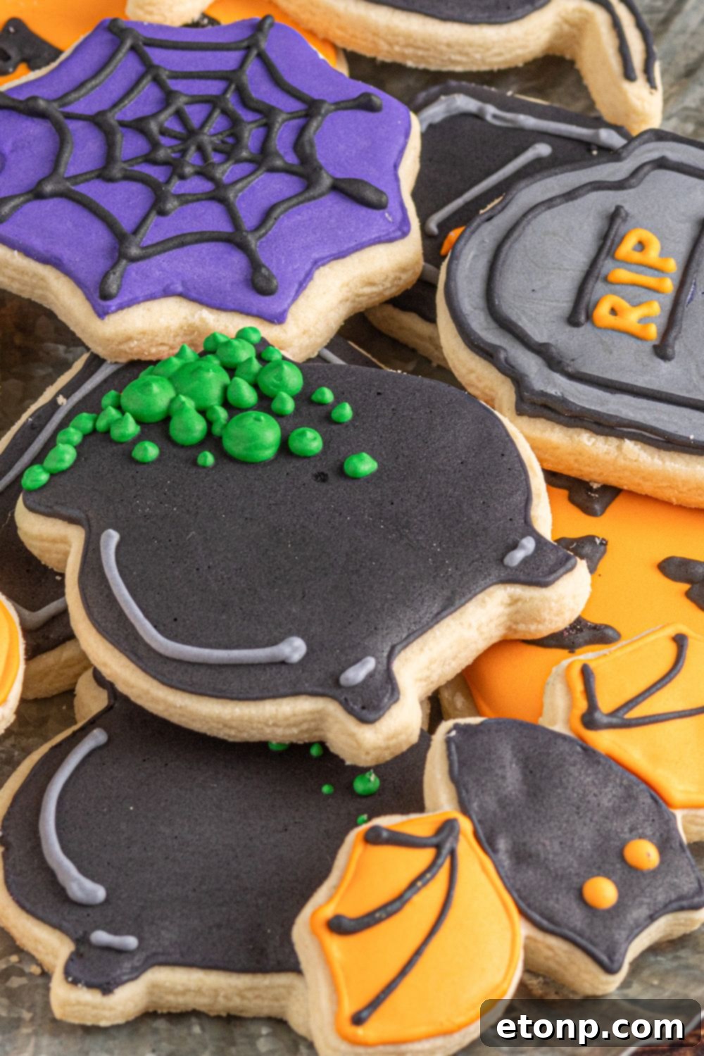 stack of halloween themed cookies on a tray