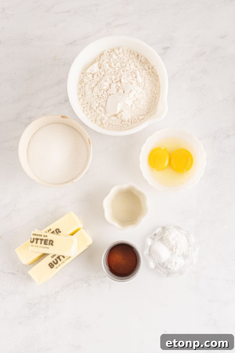 ingredients for sugar cookies on table in bowls