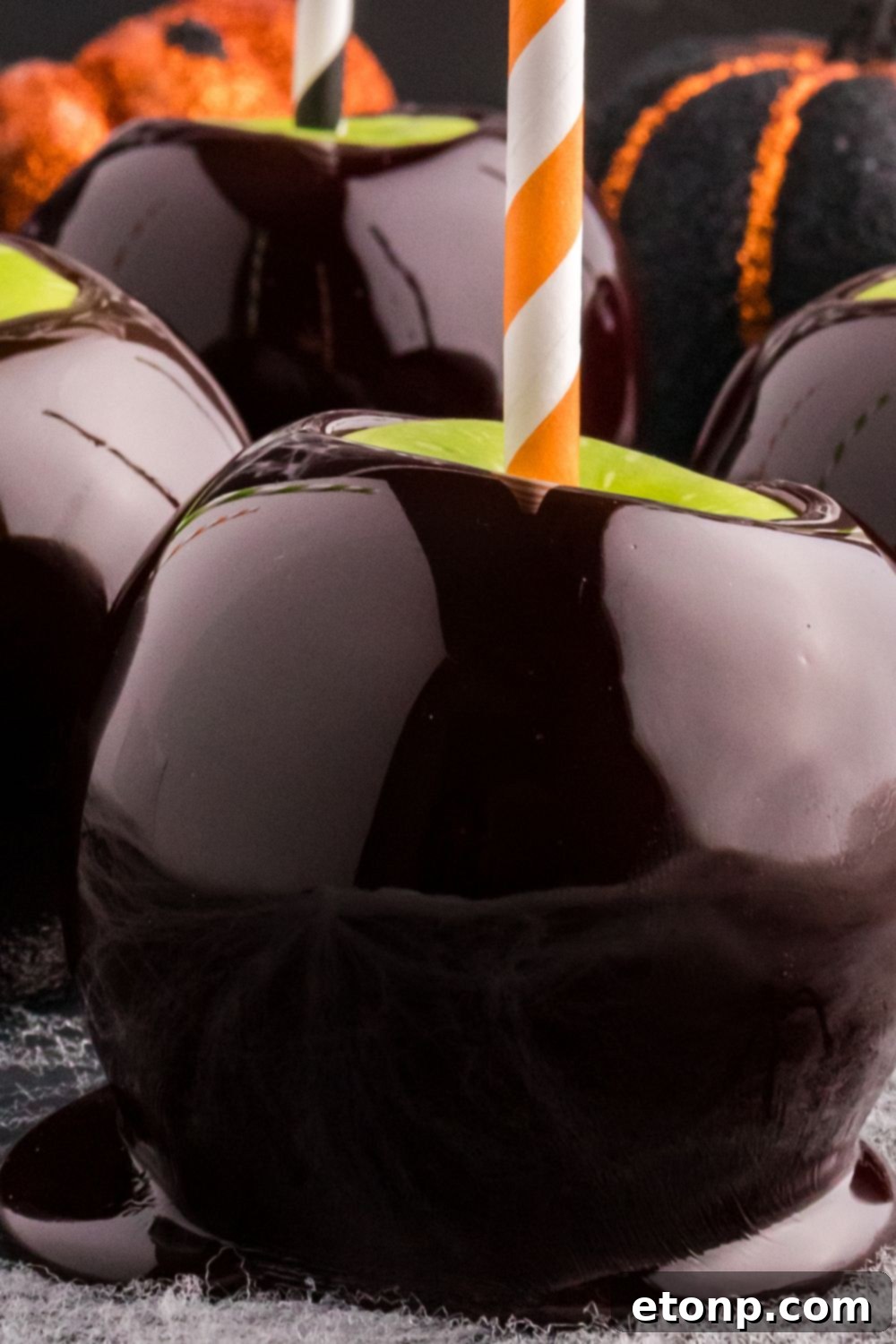 close up of black candy apple