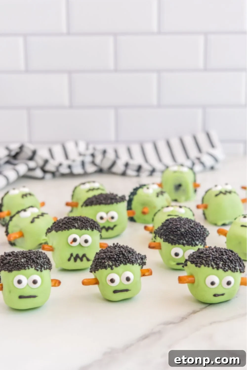halloween oreo balls designed to look like frankenstein on table