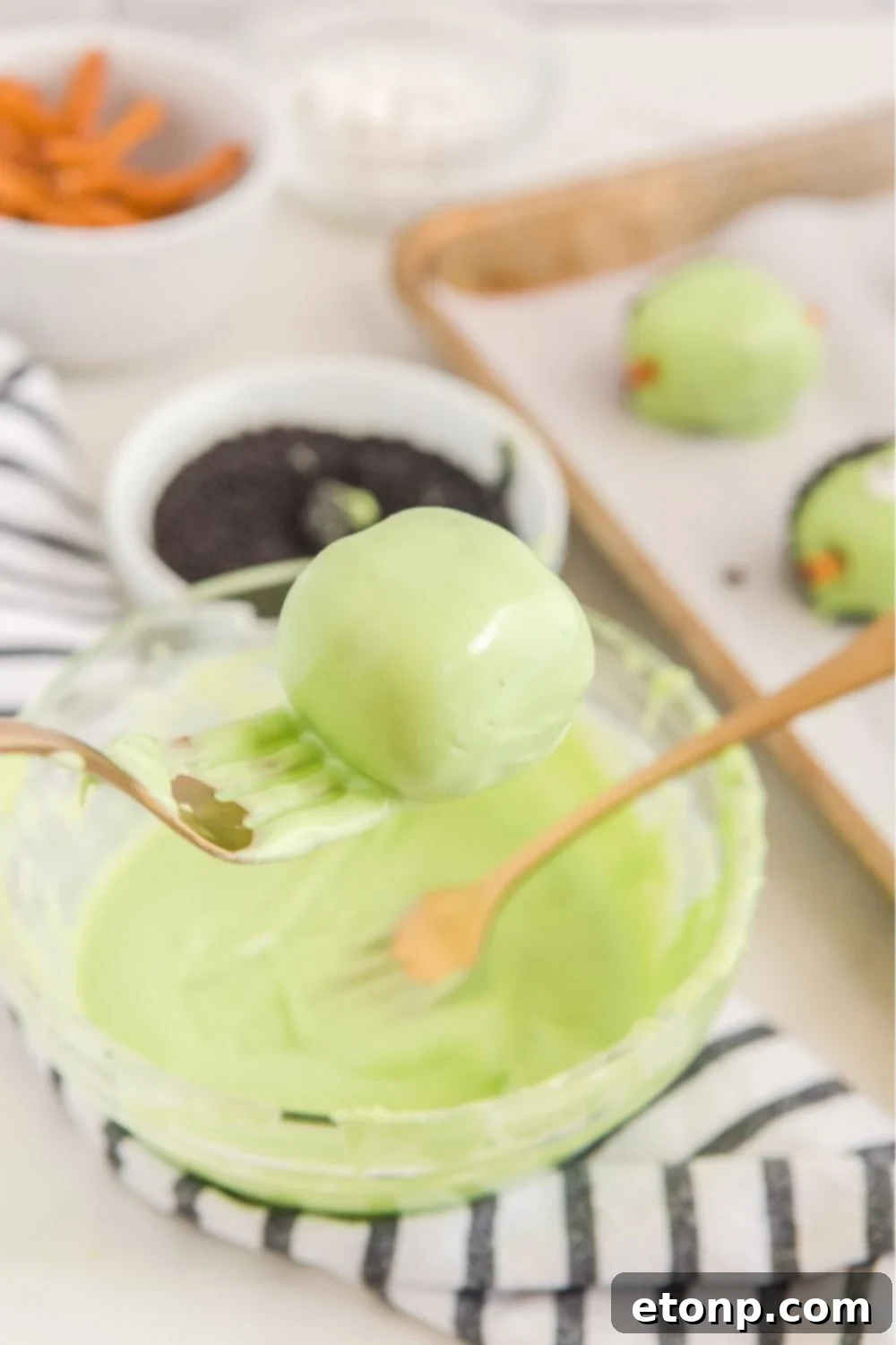 green dipped oreo ball in melted choclate 