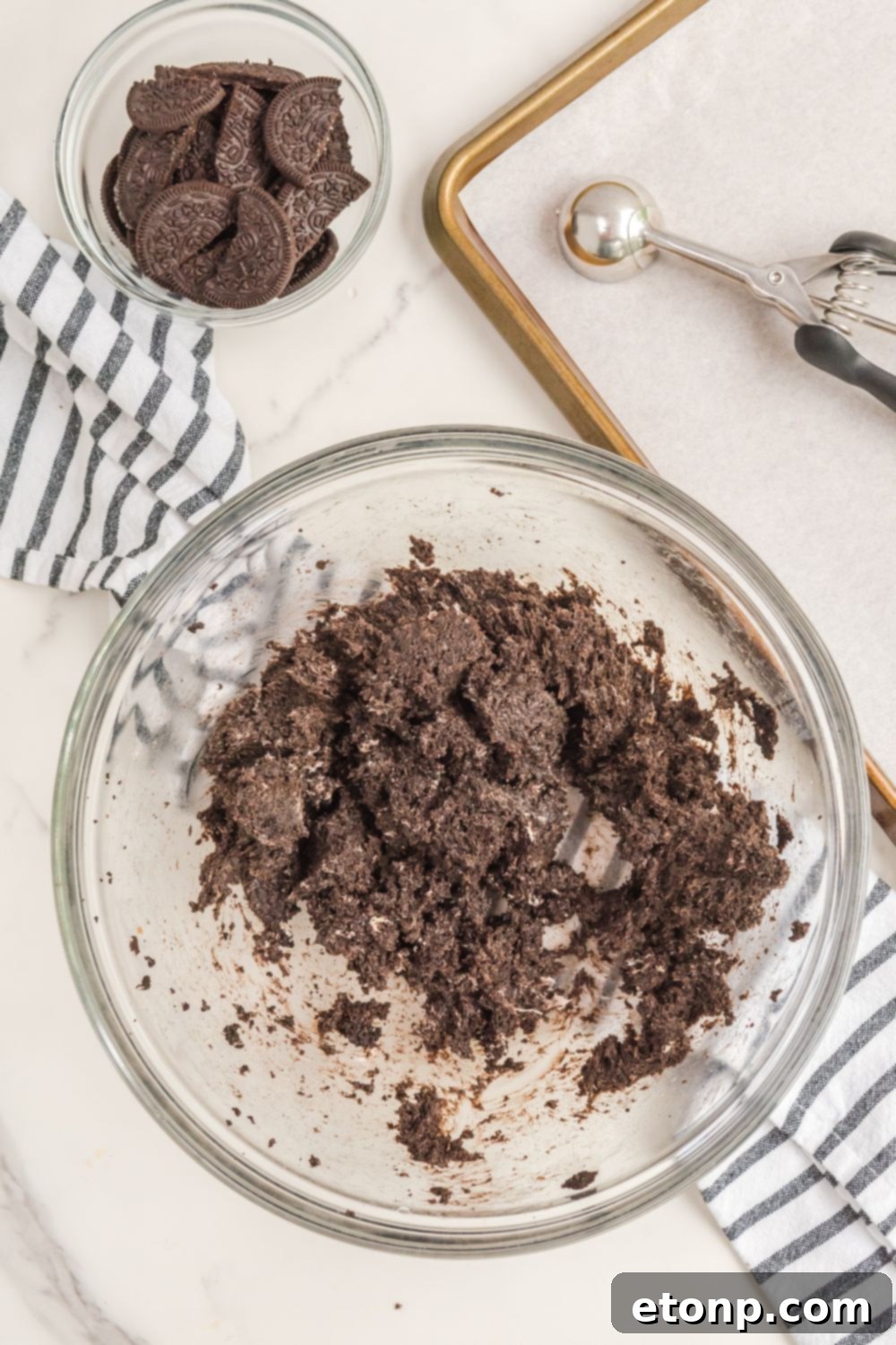 The blended Bat Oreo Truffles mixture, a smooth, dark dough-like consistency in a bowl