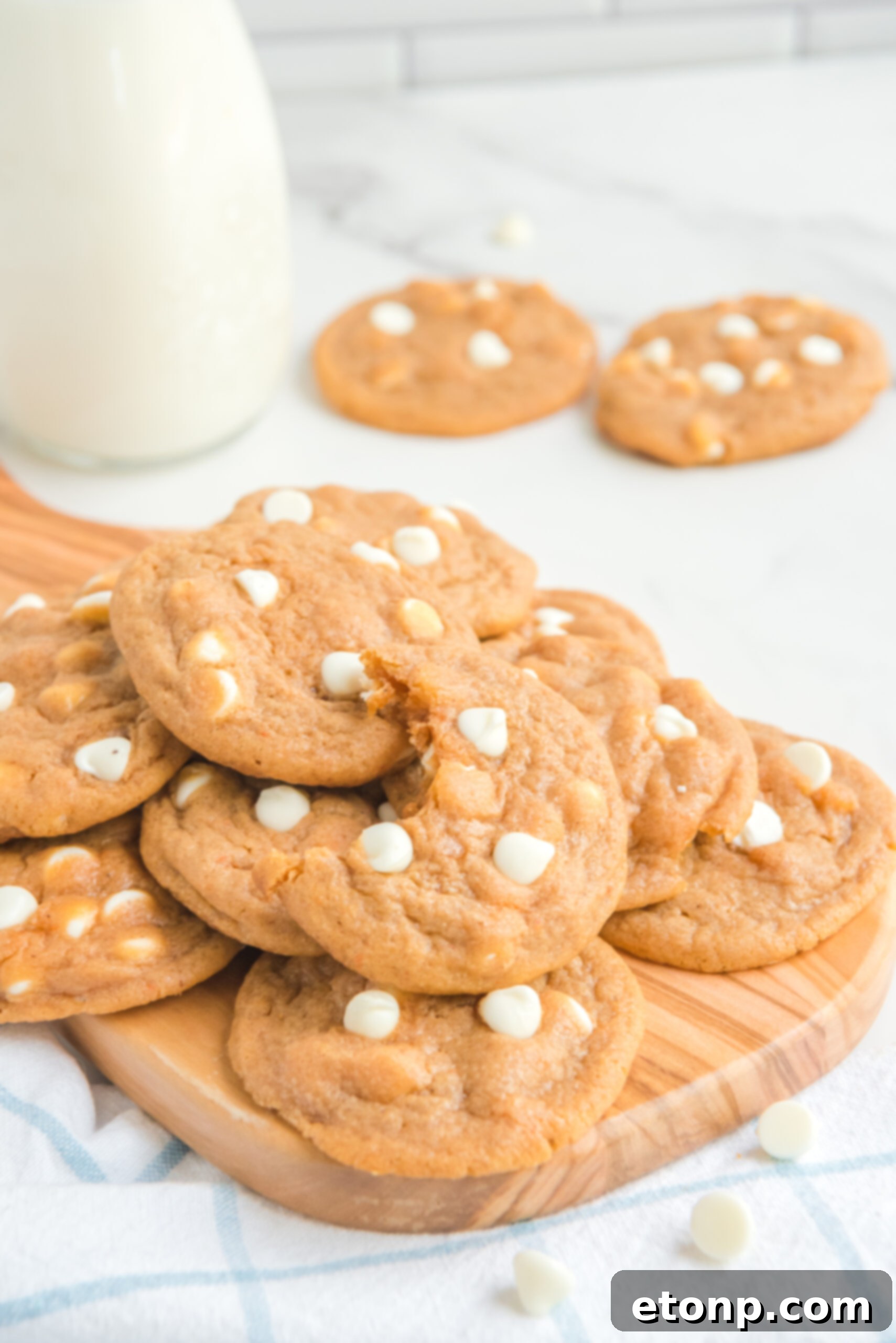 Pumpkin Spice Pudding Cookies on a wooden cutting board