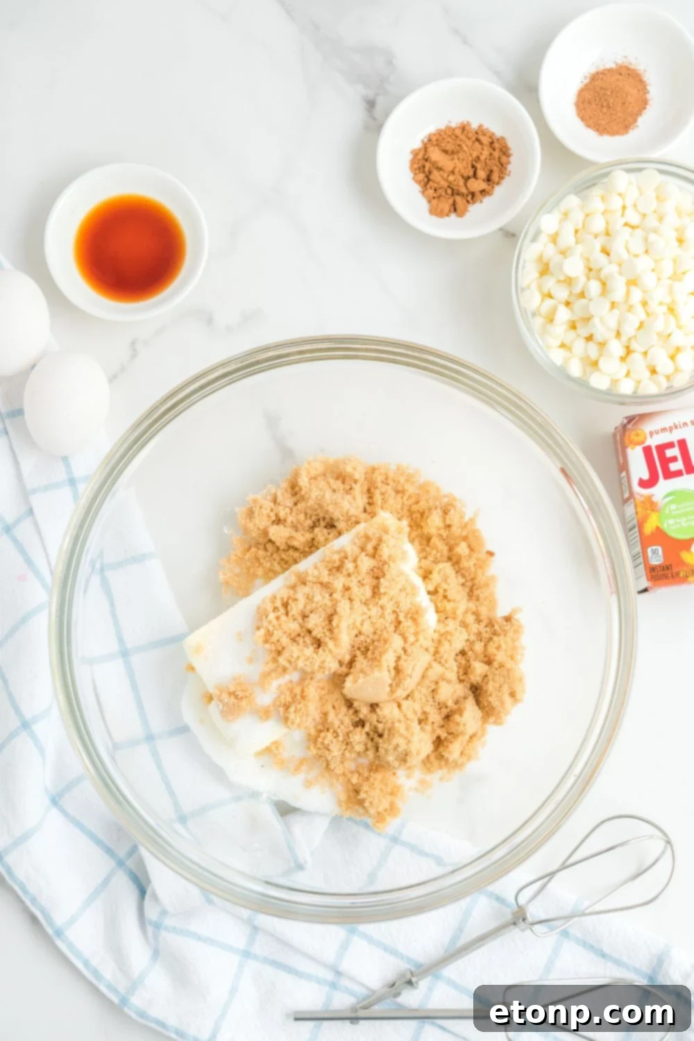 butter and sugar in a glass mixing bowl 